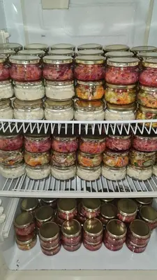 a refrigerator filled with lots of jars of food at Capital Hill Stay at Spa in Pretoria