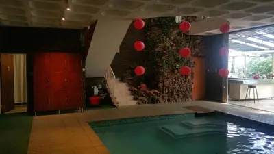 a swimming pool in a room with red balloons at Capital Hill Stay at Spa in Pretoria