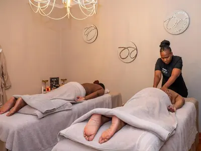 two people laying on beds in a hospital at The Stella Guest House & Spa in Ermelo