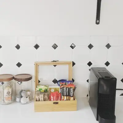 a kitchen counter with a box of food and a printer at Apartment close to Menlyn Maine in Pretoria