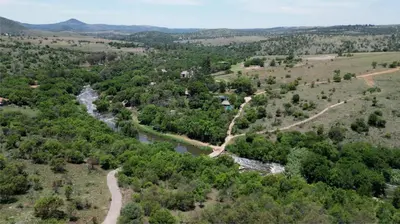 an aerial view of a river and trees at Forestiva Farm - River Cottage in Centurion