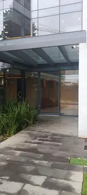 an entrance to a building with glass doors at Menlyn Maine Trilogy Penthouse 42 in Pretoria