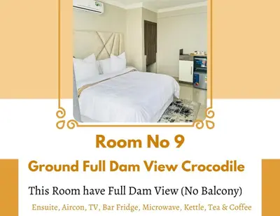 a room with a white bed with a mirror at The Holiday House Harties in Hartbeespoort