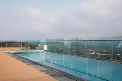 a swimming pool on the roof of a building at The Comfort AirB&B - On the 8th floor luxury 1 bedroom apartment with views in Pretoria