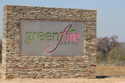 a sign on the side of a brick building at Greenfire Game Lodge in Balule Game Reserve
