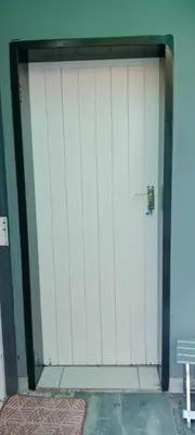 a large white garage door in a building at Botanik in Pretoria