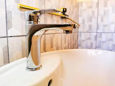 a faucet on a sink in a bathroom at Genesis Guesthouze in Bela-Bela