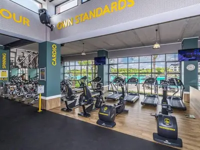 a gym with treadmills and elliptical machines at The Blyde in Pretoria