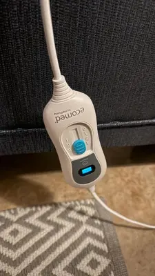 a remote control sitting on top of a carpet at Dullstroom Self Catering Blue Crane Estate 66 in Dullstroom