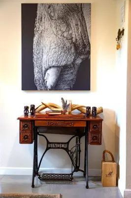 a desk in a room with a picture on the wall at Ndlovu Bushvilla at Elephant Rock Eco Estate in Mica
