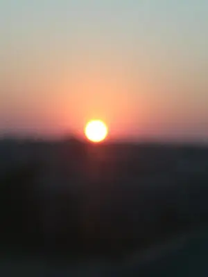 a sunset with the sun setting in the background at Bushbuckridge Micanolia Guest House in Dwarsloop