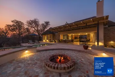 a fire pit in the middle of a patio at Villa Lanterfant - luxury stay in nature - solar powered in Hoedspruit