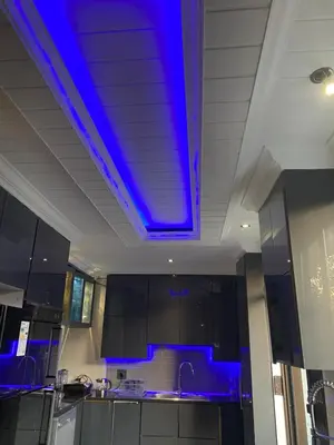 a kitchen with a blue light on the ceiling at Bridgelamour Accommodation in Hartbeespoort