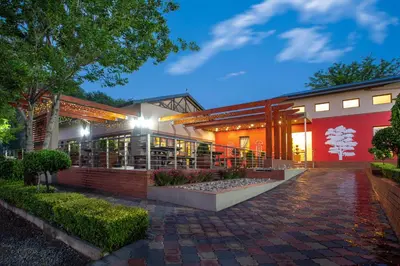 a building with a brick walkway in front of it at Bluegum Country Lodge in Bethal