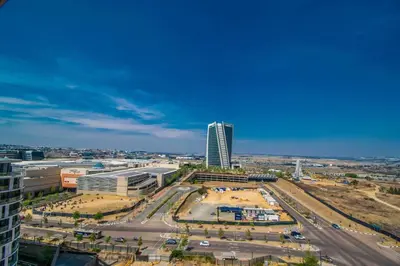 an aerial view of a city with a tall building at Beautiful Gem at Ellipse in Midrand