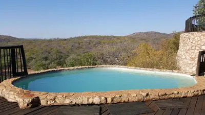 a large pool sitting on top of a wooden deck at Adansonia Eco Lodge in Musina