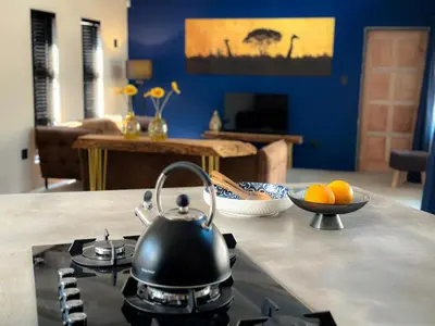 a tea kettle on top of a stove in a kitchen at Geelslang Paradise - Kruger Park in Marloth Park