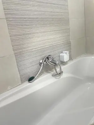 a white bath tub with a faucet in a bathroom at 473 On Cliff in Pretoria
