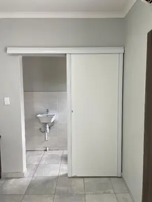 a bathroom with a white toilet and a sink at 473 On Cliff in Pretoria