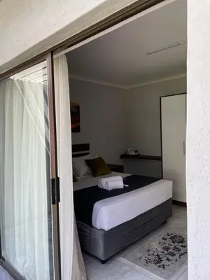 a bedroom with a bed and a window at 473 On Cliff in Pretoria