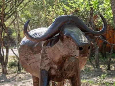 a statue of an elephant with its trunk on at Kruger Maroela Lodge in Marloth Park