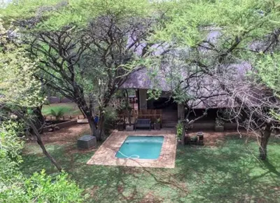an overhead view of a swimming pool in a backyard at Mispel House self catering holiday accommodation in Komatipoort