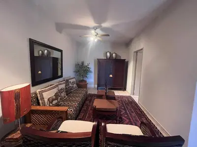 a living room with a couch and a table at Lake house retreat in Haenertsburg