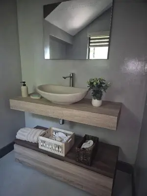 a bathroom with a sink and a mirror at 2 Lanner holiday home in Hartbeespoort