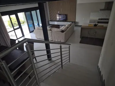 a living room with two couches and a kitchen at 2 Lanner holiday home in Hartbeespoort