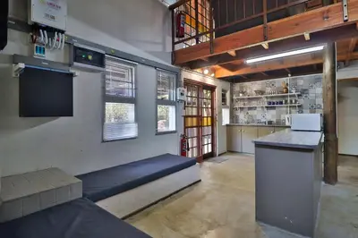 a kitchen with a counter and a bar in a room at P.A.P.E's RETREAT in Marloth Park