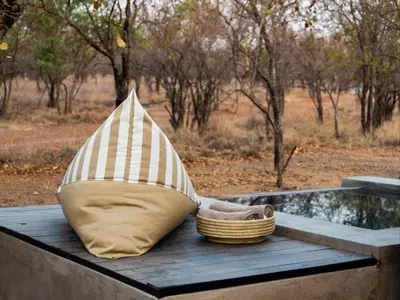 a boat sitting on a table with a basket at Minara Private Boutique Game Lodge in Dinokeng Game Reserve