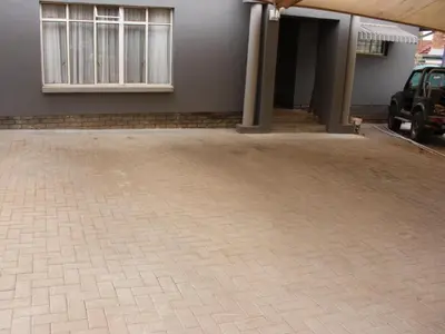 a brick driveway in front of a house at Blesbok Inn in Polokwane