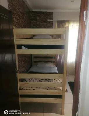 a set of bunk beds in a room at Secunda BackPackers in Secunda