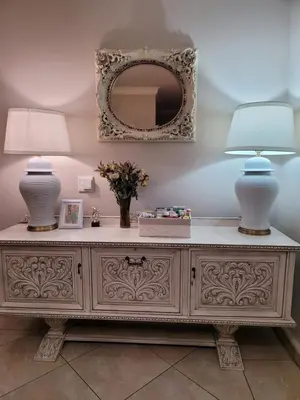 two lamps on top of a dresser with a mirror at Falcon's Nest in Pretoria