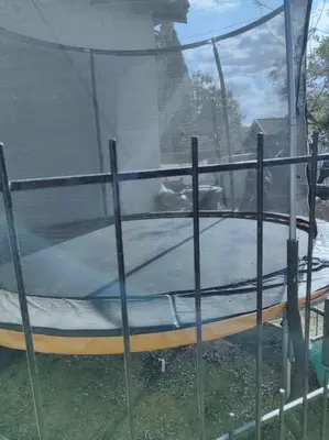 a trampoline in a yard with a window at ChoosersExpressHotel in Centurion
