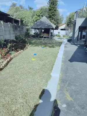 a shadow of a frisbee on the side of a yard at ChoosersExpressHotel in Centurion
