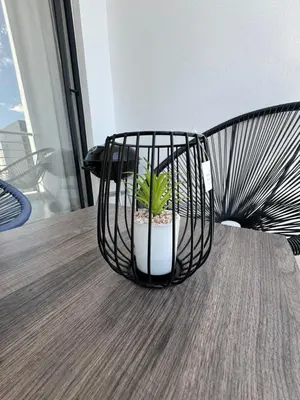 a plant in a basket sitting on a table at Midrand E Airbnb in Midrand