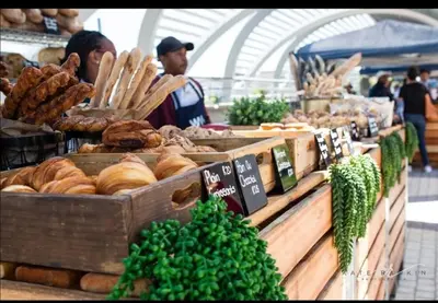 a display of bread and pastries in a market at Midrand E Airbnb in Midrand