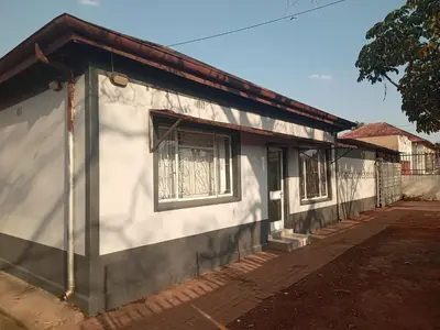 a house with two windows on the side of it at Las Palmas Day & Night Guest House in Pretoria