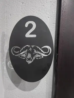 a sign with the number two on a wall at The Residence Villa in Musina