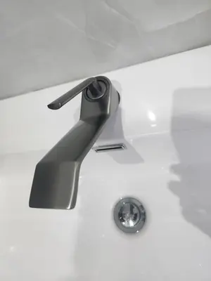 a bathroom sink with a black faucet at The Residence Villa in Musina