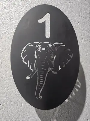 a number one sign with an elephant on a wall at The Residence Villa in Musina