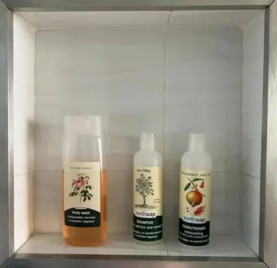 three bottles of moisturizers sitting on a shelf at Walkersons Estate- Outcrop in Dullstroom