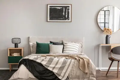 a bedroom with a bed and a mirror at The Grove in Pretoria