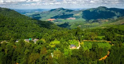 an aerial view of a house in the mountains at Kuhestan Farm Cottages in Haenertsburg