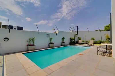a swimming pool in the middle of a patio at Smartz Apartment312 in Midrand