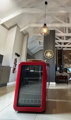 a red box sitting on the floor in a room at Waterfall House in Dullstroom