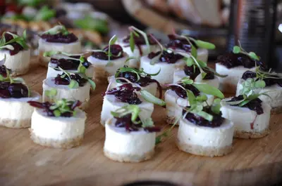 a bunch of appetizers on a wooden cutting board at Riboville Boutique Hotel And Restaurant in Midrand