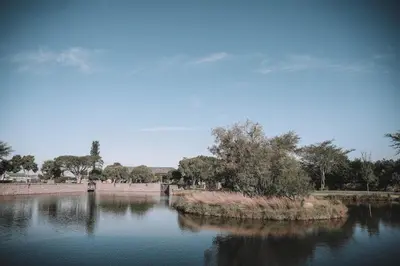 a large body of water with trees in the background at Riboville Boutique Hotel And Restaurant in Midrand