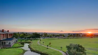 an aerial view of a park with a river at Riboville Boutique Hotel And Restaurant in Midrand
